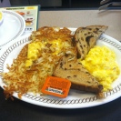 Cheese 'n eggs, rasin toast, grits and "scattered, smothered and covered"!